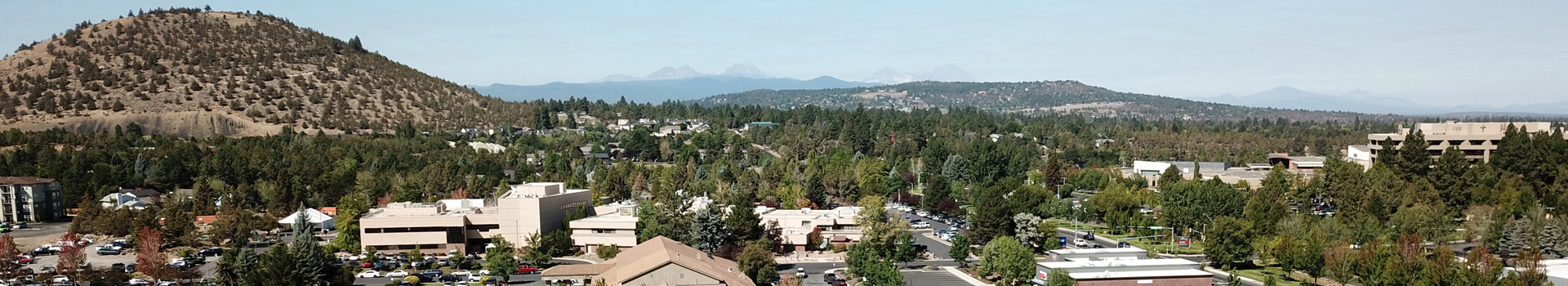 Drone shot of east Bend showing Pilot Butte in the distance