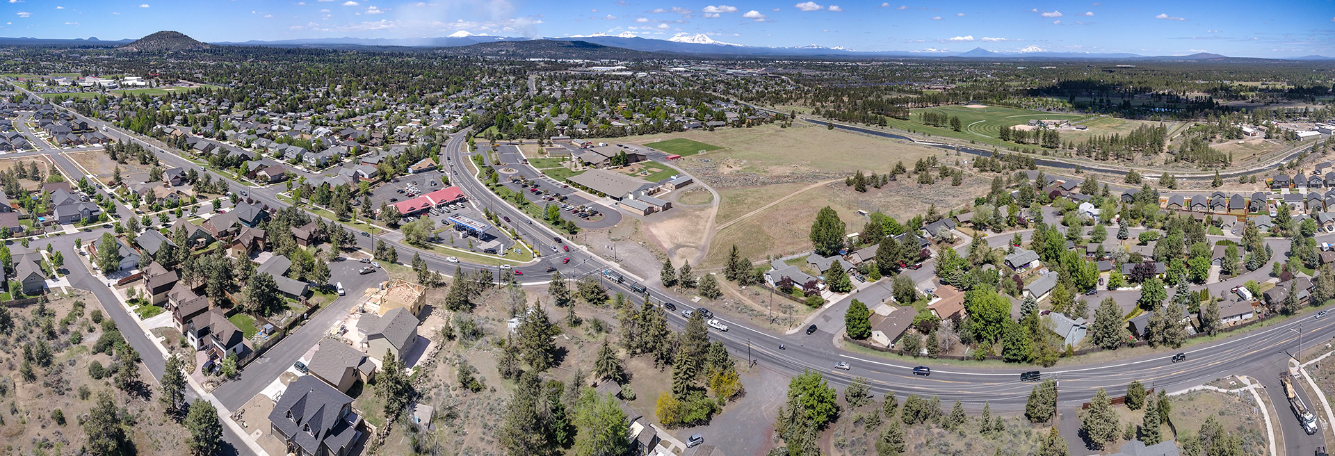 Overhead shot of partly developed and partly undeveloped land in southeast Bend. Roads and houses, along with bare land shown.