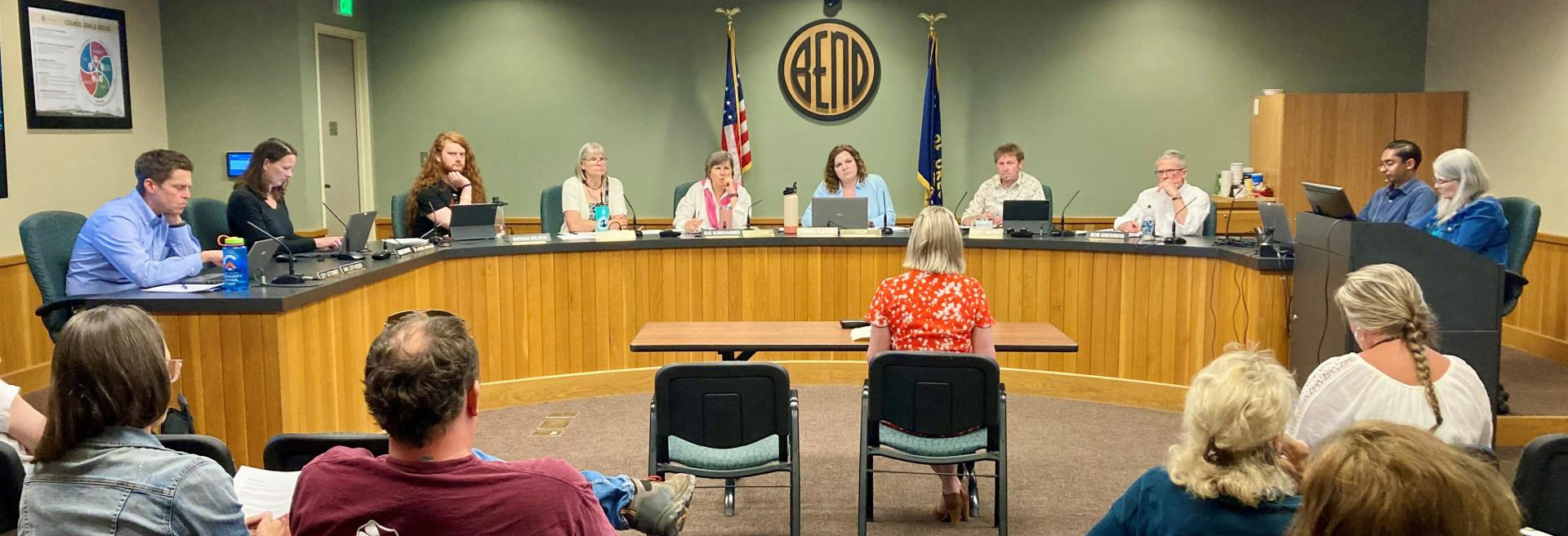 Image of diesis with Planning Commision members sitting around and working. 