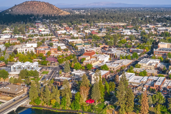 The City of Bend looking east from overhead. Pilot Butte is in the background.